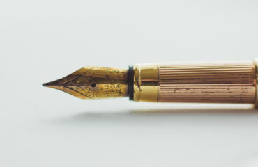 Gold Ink Pen | McLarty Wolf Litigation Lawyers