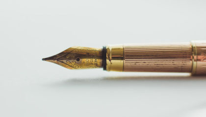 Gold Ink Pen | McLarty Wolf Litigation Lawyers