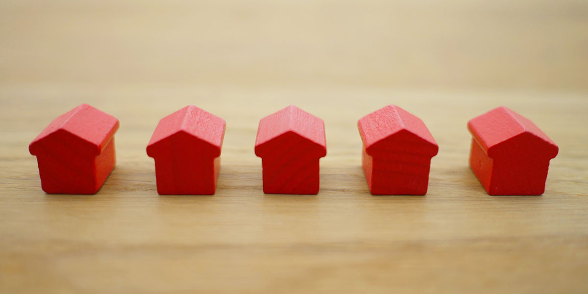 5 Small Wood Red Homes on The Table | McLarty Wolf Litigation Lawyers